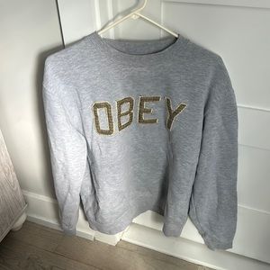 OBEY grey crew neck with plaid stitch letters